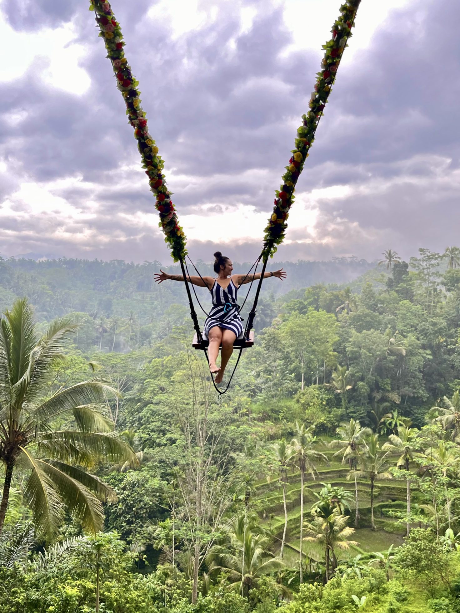 Andrea swinging over rice plantation in Bali