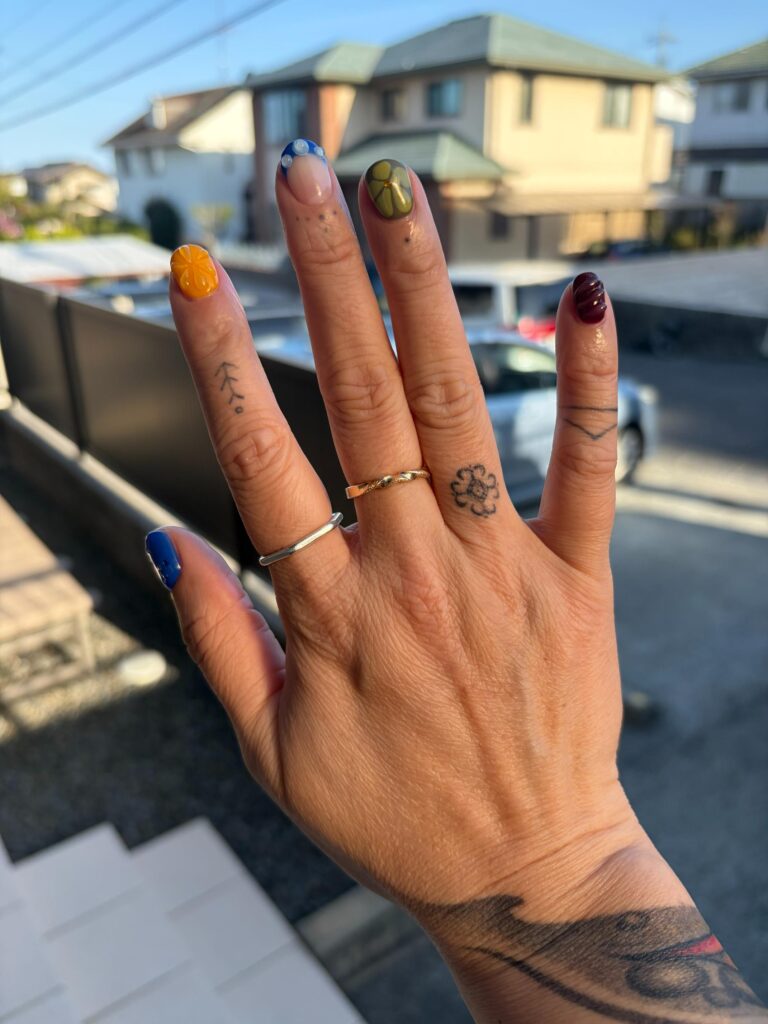 hand with tribal Filipino tattoos